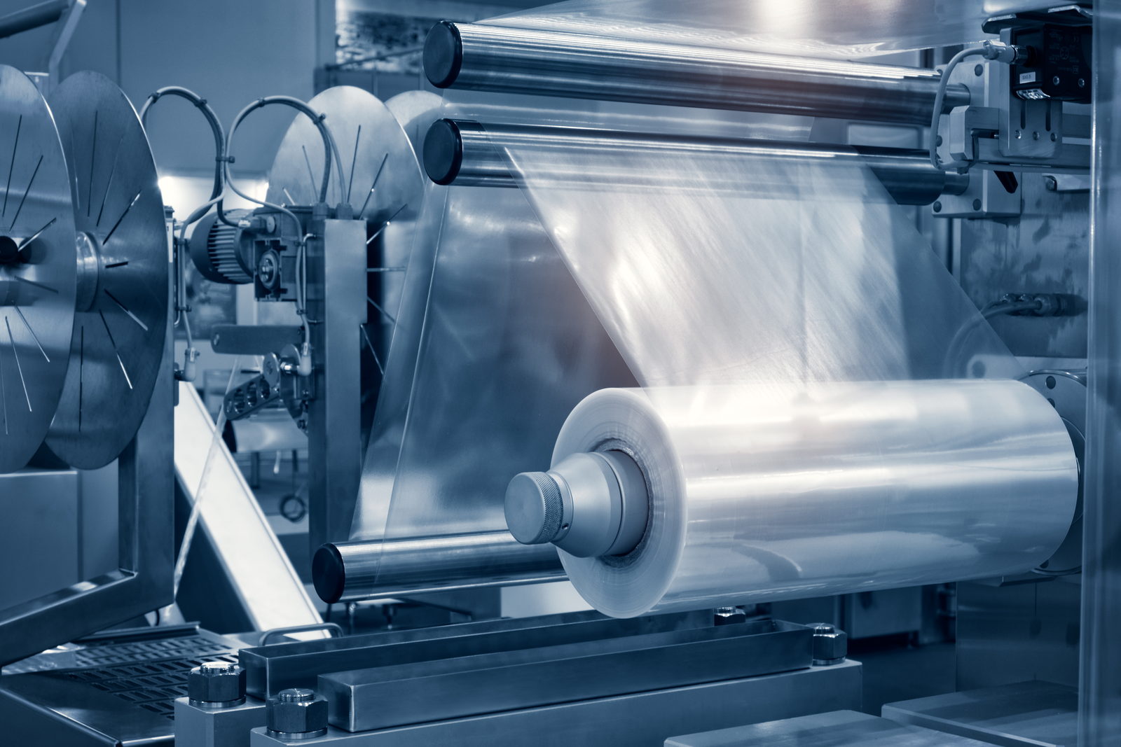 Film roll feeding through a laminating machine